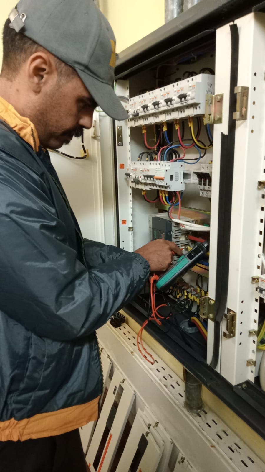 FM+ technician measuring a switchgear panel